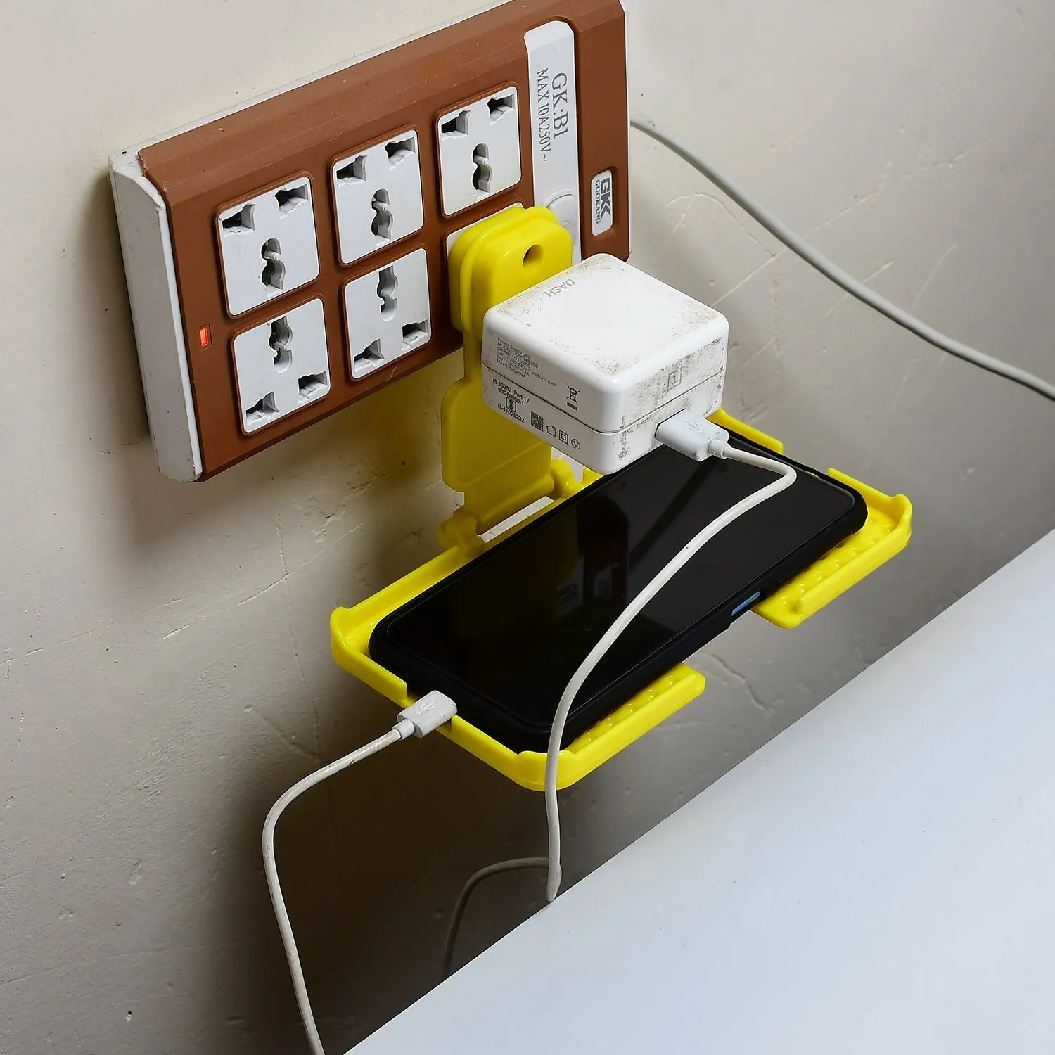 Multi-Purpose Wall Holder Stand for Charging Mobile Just Fit in Socket and Hang (Yellow)